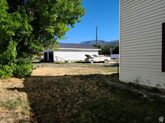 View of grassy yard with a mountain view | Image 36