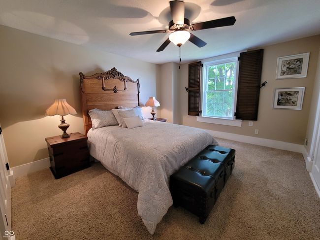 Upstairs bedroom with original shutters. Bed headboard is original to the house and has been restored. Will stay with the property. | Image 59