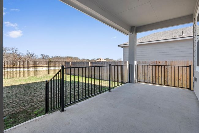 Fenced backyard featuring a patio area | Image 32