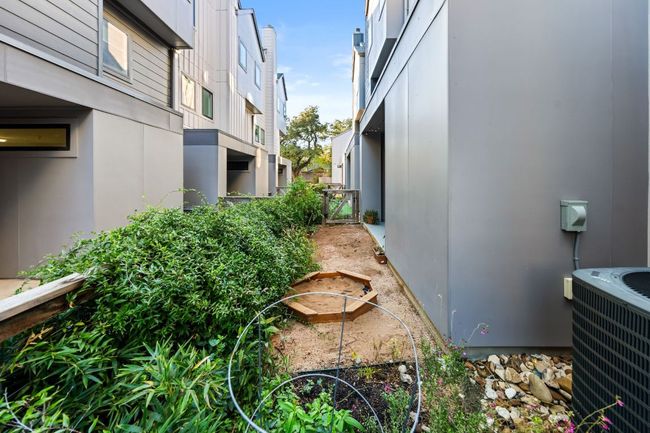 View of side of home featuring stucco siding and central air condition unit | Image 32