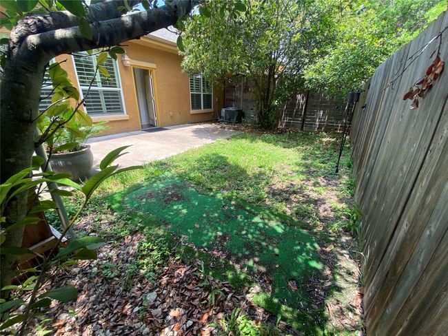 Backyard is perfect for table and chairs, gardening and outdoor enjoyment. | Image 6