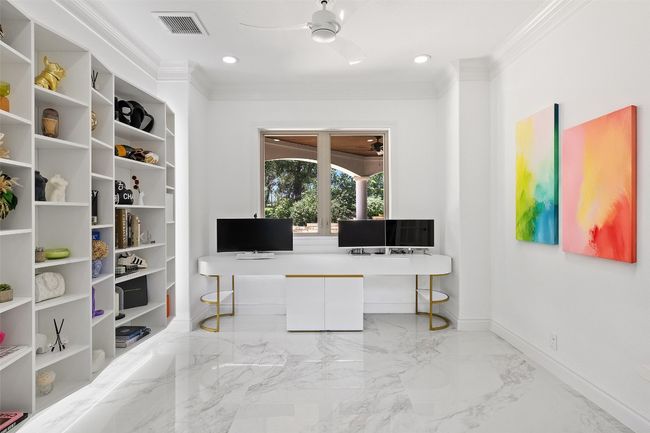 Home office featuring ornamental molding, baseboards, ceiling fan, marble finish flooring, and recessed lighting | Image 15