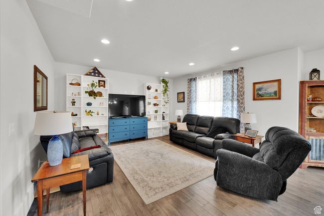 Living room featuring recessed lighting and wood finished floors | Image 11