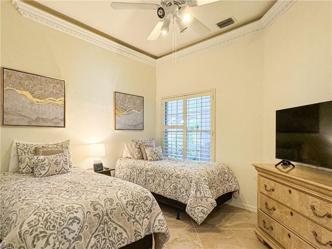 Bedroom featuring tile floors, ceiling fan, and ornamental molding | Image 20