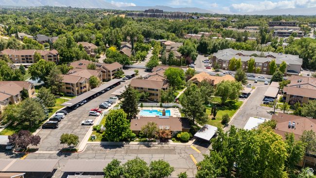Aerial perspective of suburban area with mountains and a pool area | Image 29