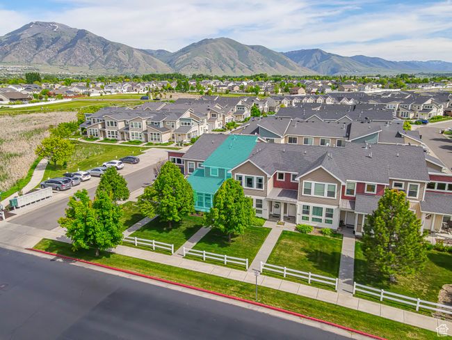 Aerial view of residential area featuring a mountain backdrop | Image 25