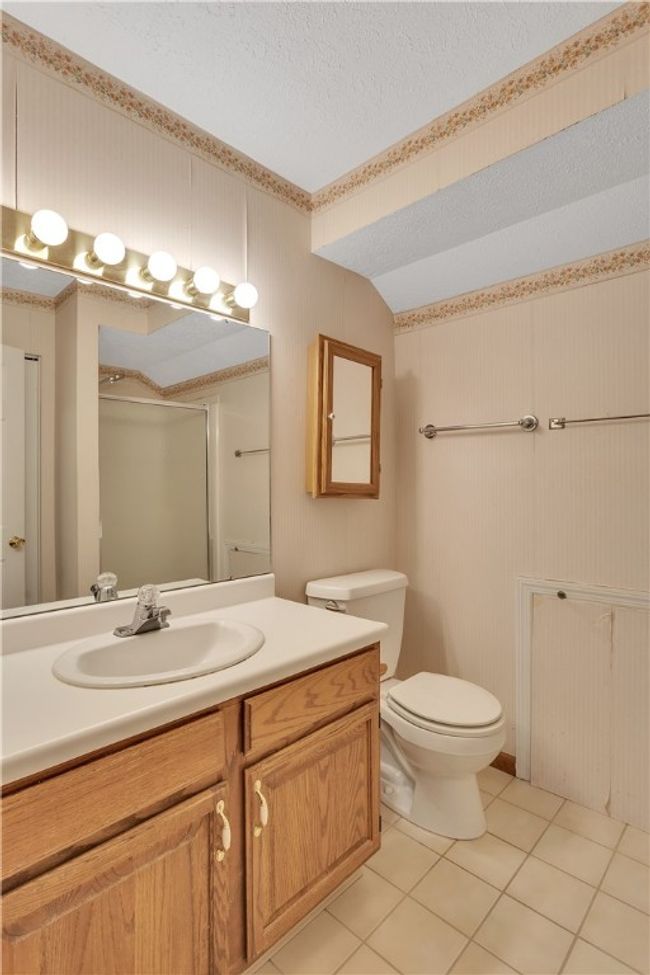 Upper en Suite Bath with Tile Floor, Shower, and Linen Closet. | Image 28