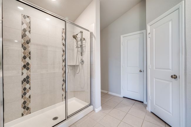 Large walk in shower with stone accents | Image 14
