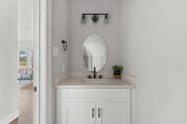 Half bath for guests near main living space. | Image 26