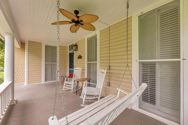Covered porch with a ceiling fan | Image 33