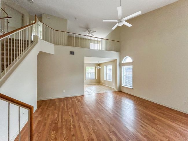 Living Room leading to the Kitchen and Stairs Leading Upstairs | Image 4