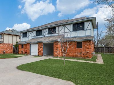 View of front of property featuring a garage and a front yard | Image 3