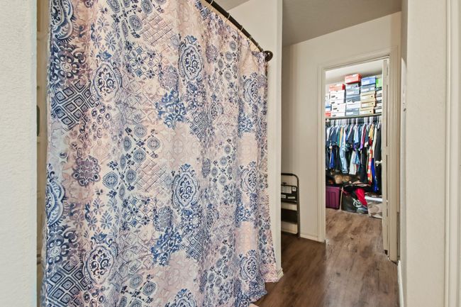 Primary bathroom to closet | Image 13