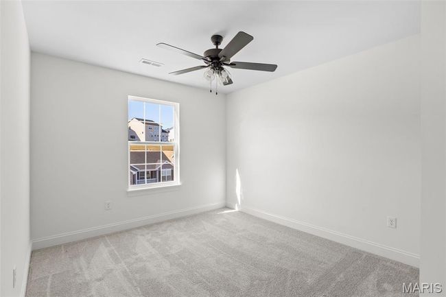 Unfurnished room featuring carpet flooring and a ceiling fan | Image 10