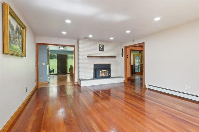 Living Room w brick fireplace hardwood fl | Image 4