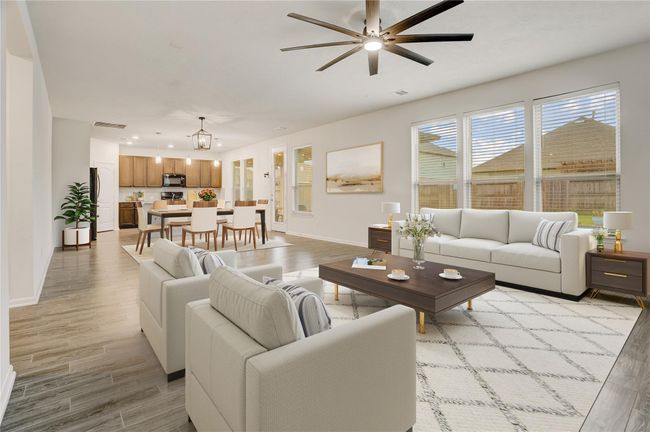 As you enter the living room, you are greeted with big, beautiful windows, tall ceilings and all the room you need for your living furniture. | Image 7