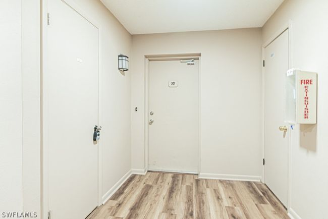 Doorway featuring light hardwood floor/ plus storage unit | Image 2