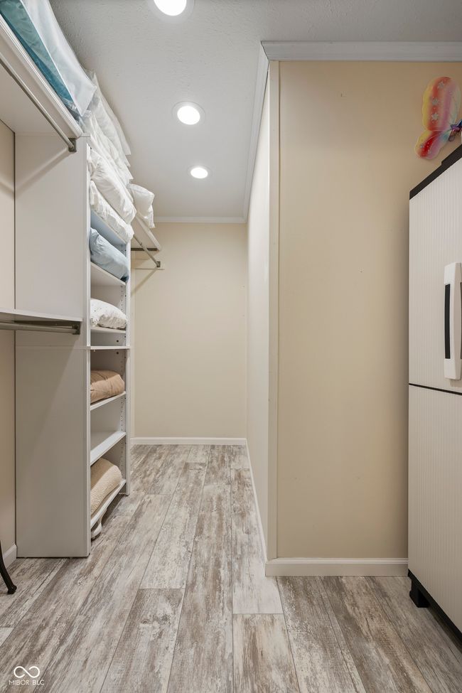 spacious closet featuring wood finished floors | Image 29