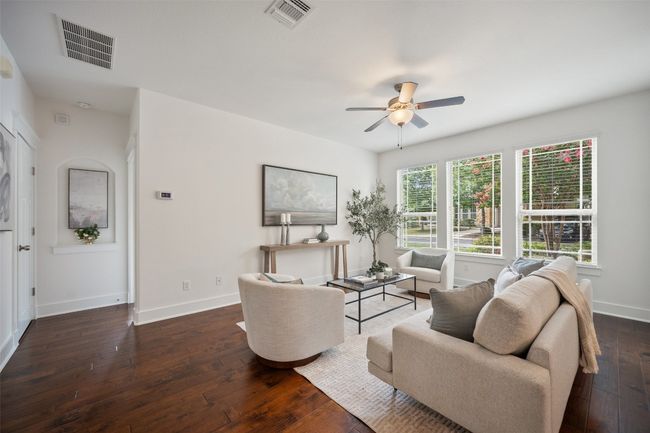 Neutral-toned walls in the living room create a calming backdrop, allowing you to easily personalize the space to suit your style, while enhancing the room’s bright and airy feel | Image 7