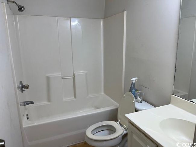 Bathroom with vanity and bathing tub / shower combination | Image 9