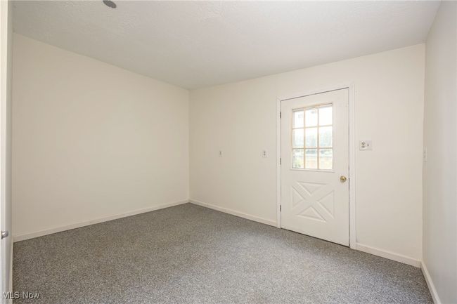 Carpeted spare room featuring baseboards | Image 16