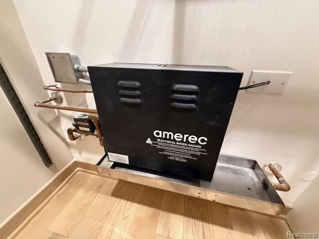 Detailed view of a garage door opener and wood finished floors | Image 23