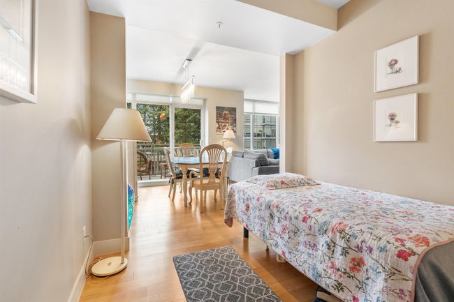 Bedroom with light wood finished floors and baseboards | Image 5