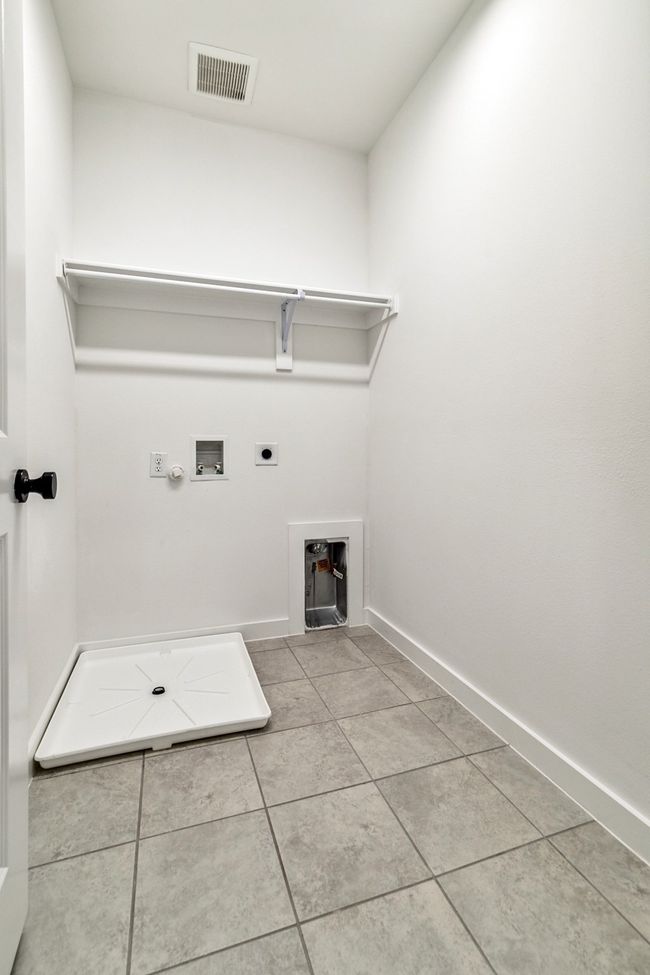 Laundry room featuring hookup for a washing machine, hookup for an electric dryer, gas dryer hookup, and baseboards | Image 23