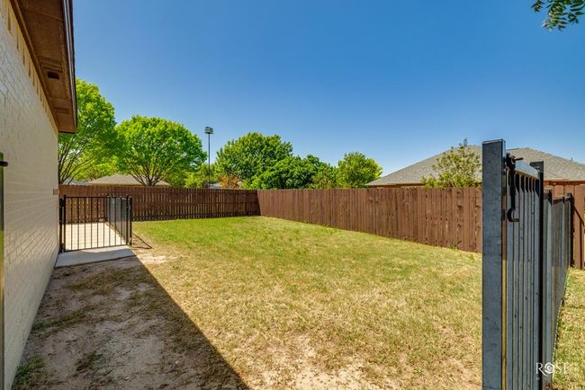 privacy fence and wrought iron fence for a dog run | Image 49