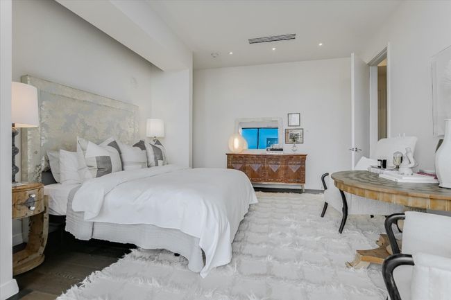 Generously scaled, the primary suite easily accommodates a king bed, seating area, and additional furnishings. | Image 21
