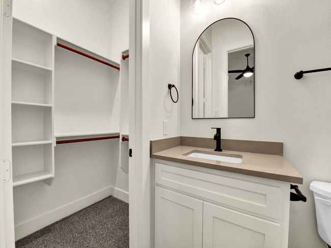 Bathroom with ceiling fan, toilet, and vanity | Image 21