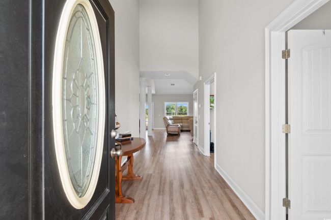 Entrance foyer with light wood-type flooring and a high ceiling | Image 4