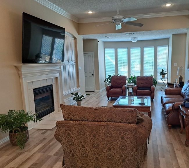 Enormous Living Room with fireplace and plenty of natural light. | Image 12