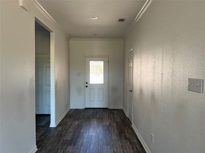 Doorway to outside with dark wood-type flooring and ornamental molding | Image 3