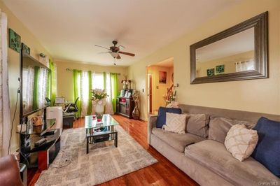 Living room featuring ceiling fan and hardwood / wood-style floors | Image 3