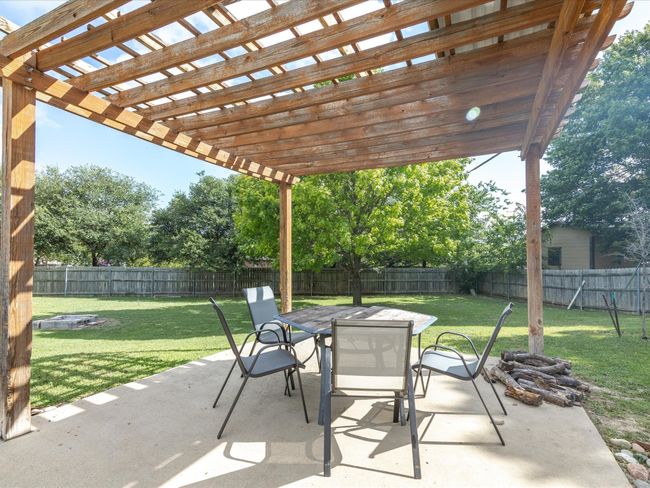 Fenced backyard featuring outdoor dining space, a patio, and a pergola | Image 30