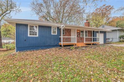 Back of property featuring a porch and a garage | Image 2