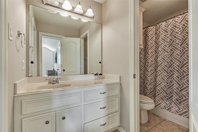 Upstairs bathroom featuring modern fixtures and ample storage. | Image 21