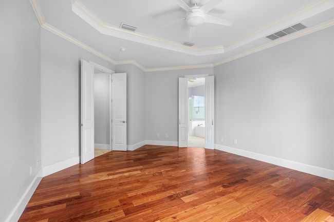 Oversized primary bedroom featuring soaring ceilings and a private ensuite! | Image 15