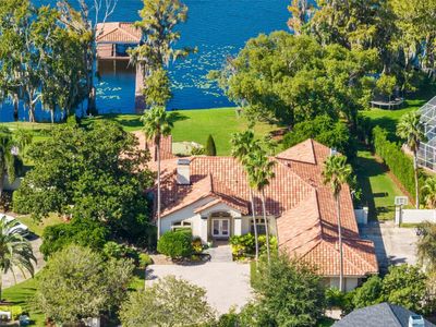 Welcome to this exquisite lakefront pool home in the covetted Tuscawilla area of Winter Springs. | Image 1