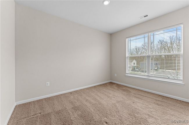 Unfurnished room featuring carpet and baseboards | Image 42