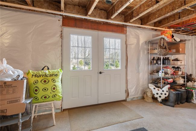 The DOUBLE DOORS that lead to the patio area out back - finish the basement for another living space - already plumbed for a full bath! | Image 41