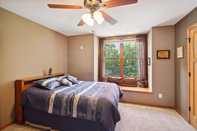 Matching upper-level bedrooms are joined by Jack & Jill bathroom | Image 18