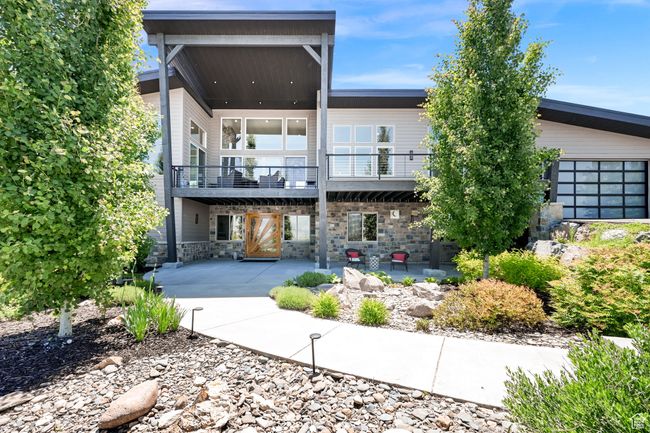 Entry of home featuring a patio and stone Water feature | Image 5