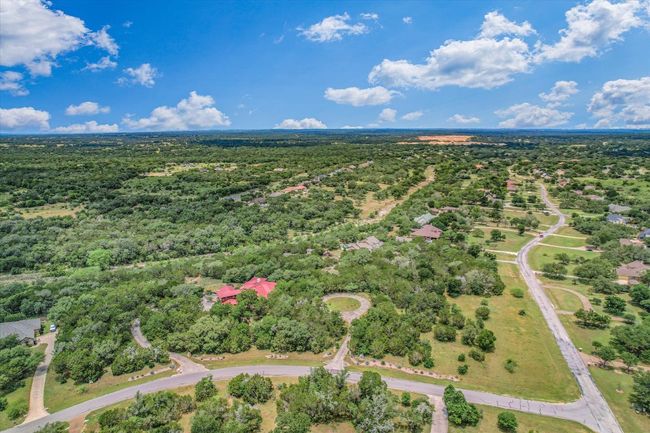 At the corner of Bartlett & Story Dr. The first two driveways are 150 Story Dr. The meadows at the front, in the circular drive and the back come alive with Bluebonnets and native flowers in the spring. The forest of trees provide a valuable asset - of privacy - and still, the other lot will allow room for their touch. The lots cannot be subdivided, as the house crosses the boundary line. | Image 35