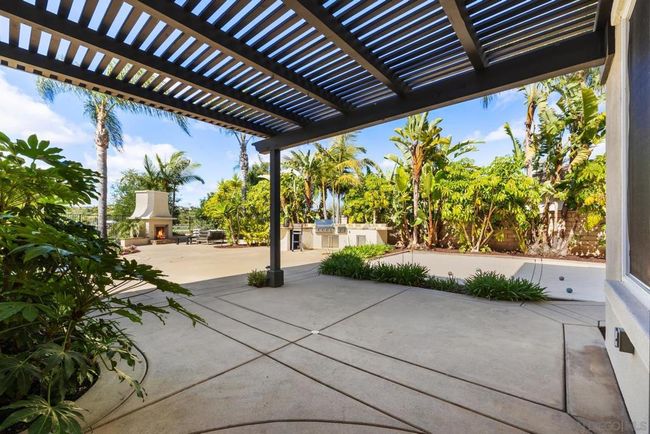Covered patio area right outside the kitchen area | Image 38