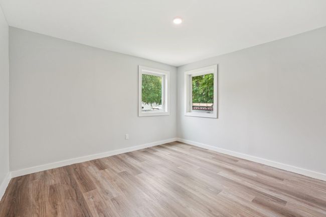 1st fl room featuring light wood-style floors and recessed lighting | Image 13