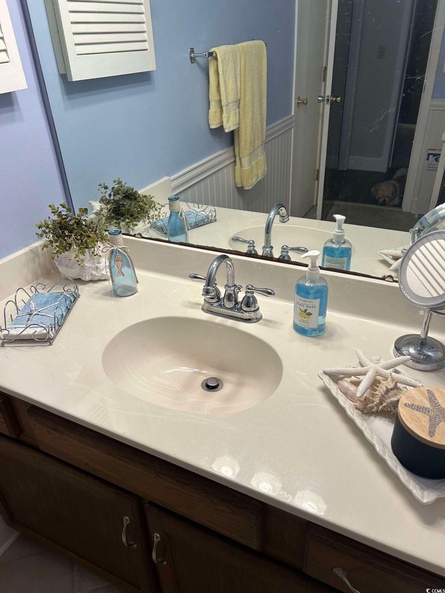 Bathroom featuring vanity and a wainscoted wall | Image 16