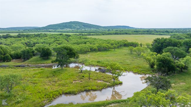 Mountain view with a nearby body of water | Image 38