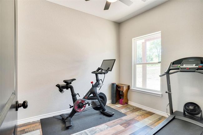 Workout area with ceiling fan and hardwood / wood-style floors | Image 19